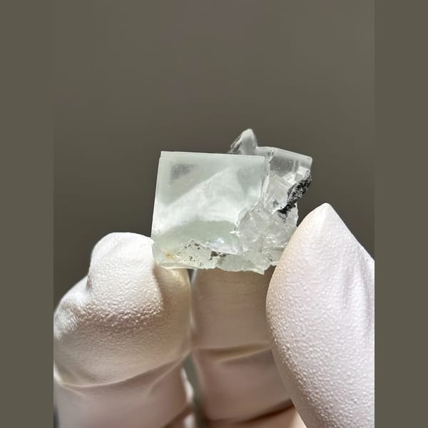 Glassy pale green fluorite cube from Zhejiang — complete view