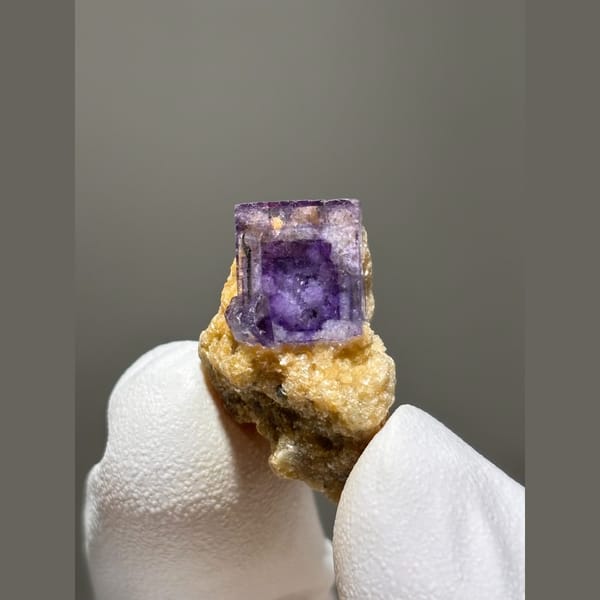 Deep purple fluorite cube on golden mica from Yaogangxian — alternate view