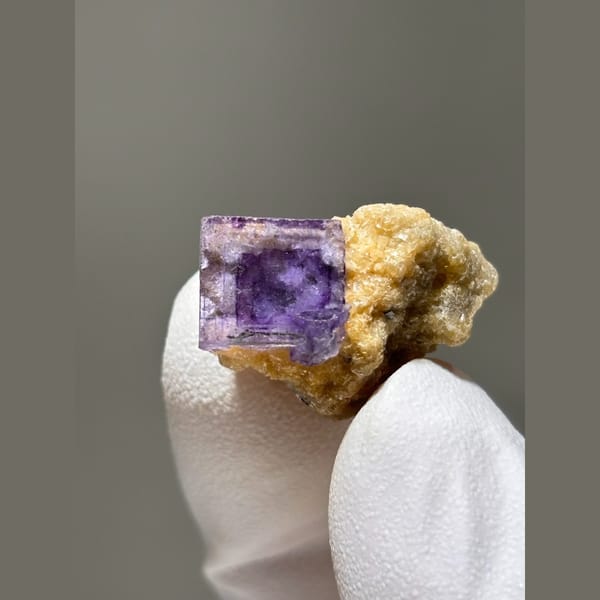 Deep purple fluorite cube on golden mica from Yaogangxian — alternate view