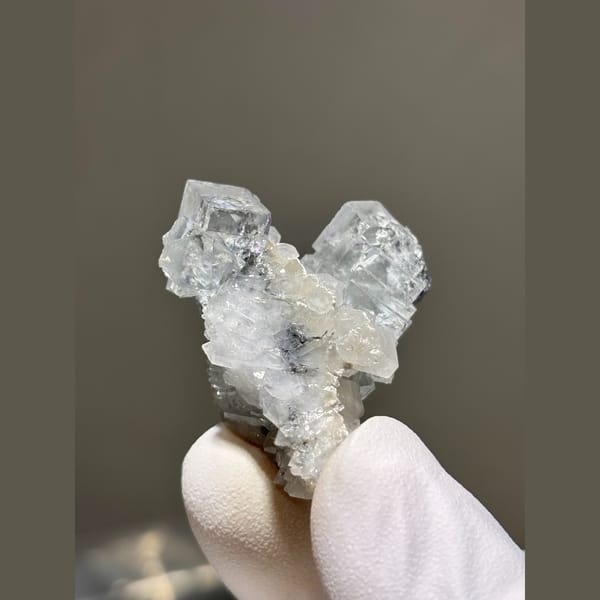 Pale blue fluorite crystals on white quartz — alternate view