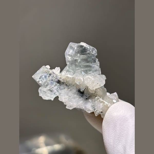 Pale blue fluorite crystals on white quartz — alternate view