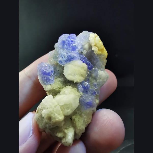 Blue fluorite with white candle quartz — detail view