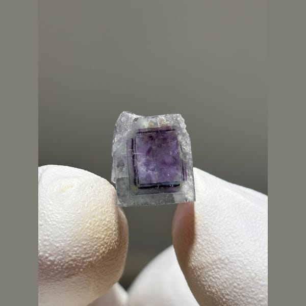 Small zoned fluorite cube with purple core from Yaogangxian — alternate view