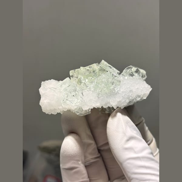 Pale green fluorite on frosty quartz plate from Zhejiang — complete view