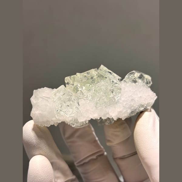 Pale green fluorite on frosty quartz plate from Zhejiang — alternate view
