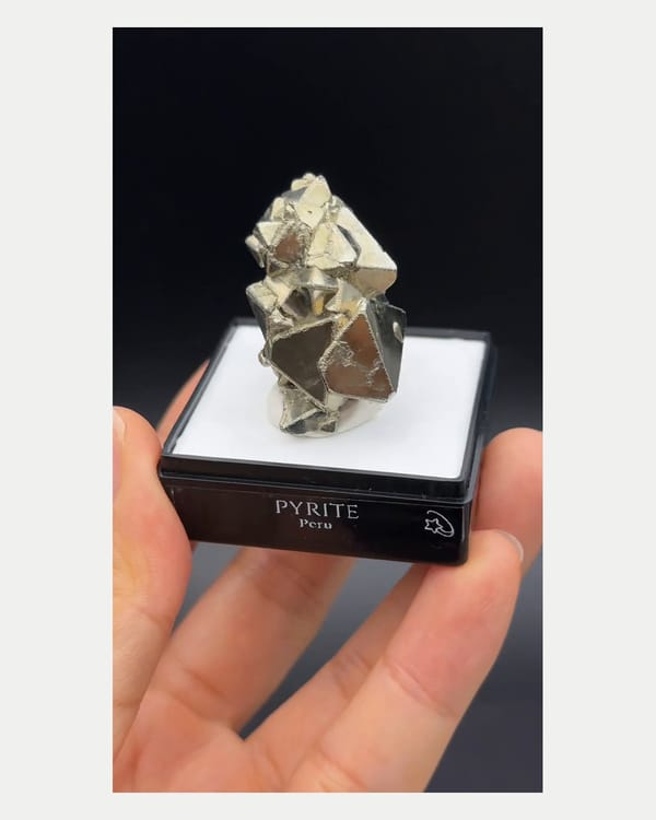 Complete front view of octahedral Peruvian pyrite cluster