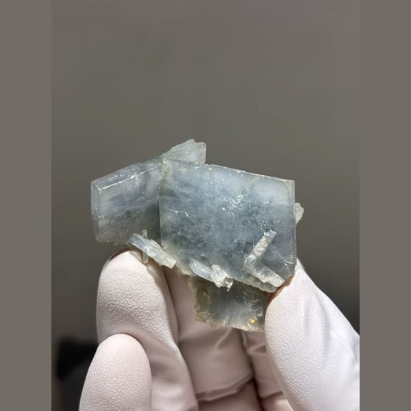 Natural pale blue bladed barite crystal cluster — detail view