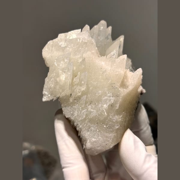 Creamy dogtooth calcite floater cluster from Hubei — complete view