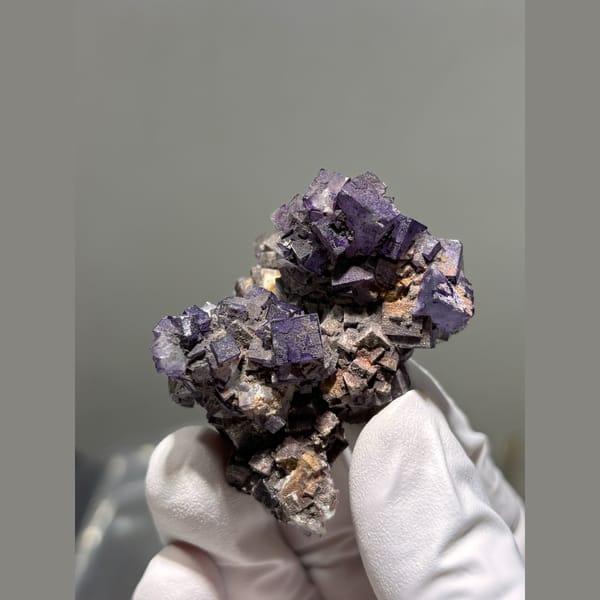 Deep purple cubic fluorite cluster from Guizhou — complete view