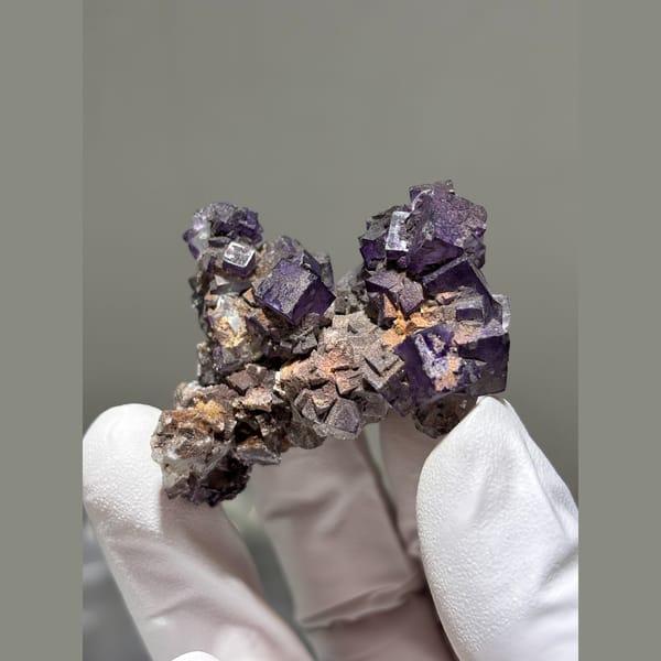 Deep purple cubic fluorite cluster from Guizhou — alternate view