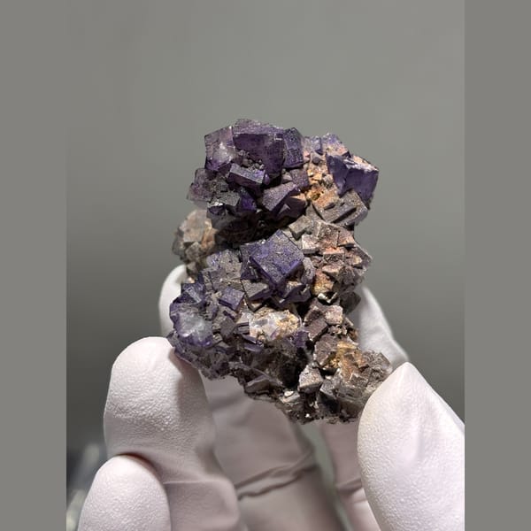 Deep purple cubic fluorite cluster from Guizhou — alternate view