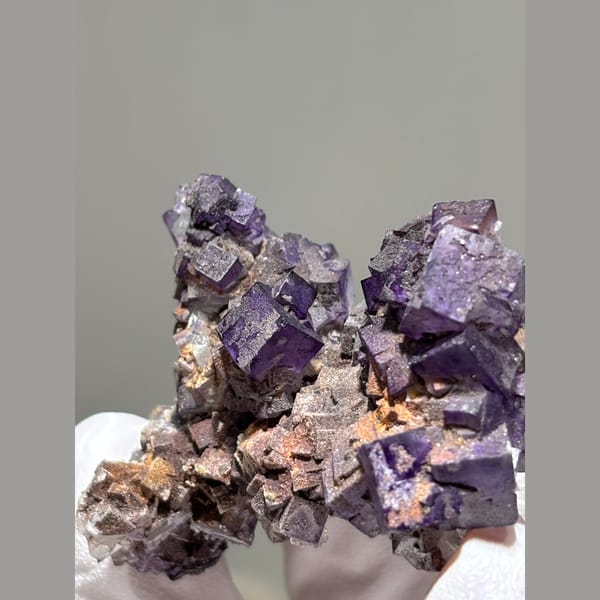 Deep purple cubic fluorite cluster from Guizhou — detail view