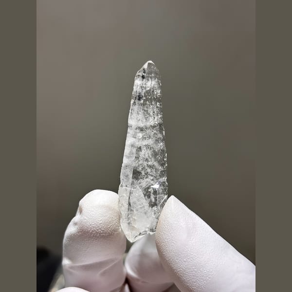 Slender double terminated clear quartz from Xuebaoding — alternate view