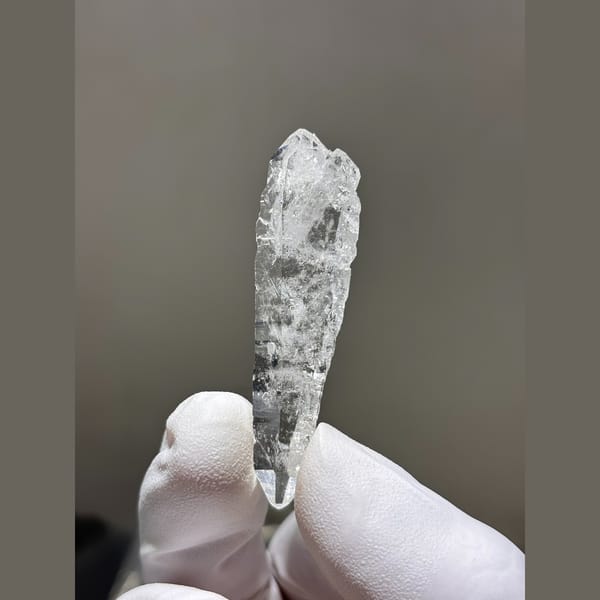 Slender double terminated clear quartz from Xuebaoding — detail view