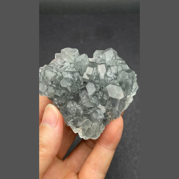 Glassy pale blue fluorite cluster from Fujian — complete view