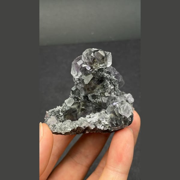 Transparent grey fluorite cube cluster from Fujian — complete view
