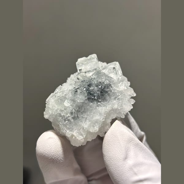 Glassy blue-green fluorite on sugary quartz from Zhejiang — complete view