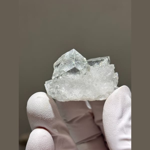 Glassy pale blue fluorite cubes on frosty quartz from Zhejiang — complete view