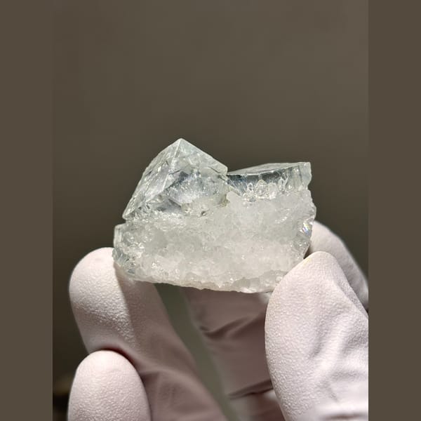 Glassy pale blue fluorite cubes on frosty quartz from Zhejiang — alternate view