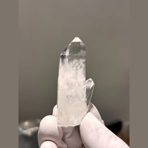 Clear quartz point with side crystal from Xuebaoding — detail view