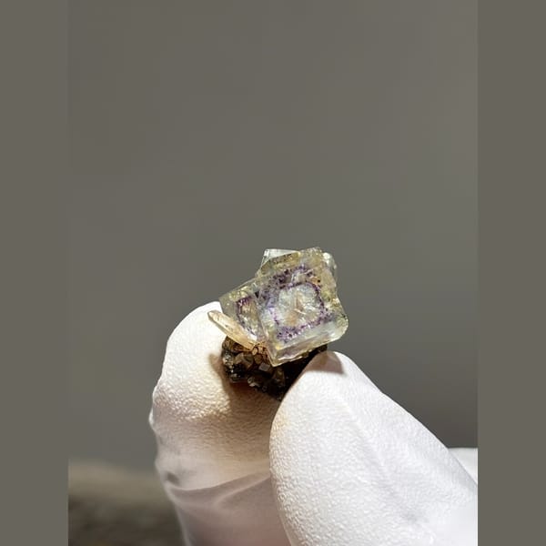 Small zoned fluorite with quartz and pyrite from Yaogangxian — alternate view