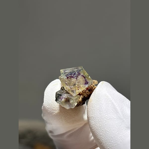Small zoned fluorite with quartz and pyrite from Yaogangxian — alternate view