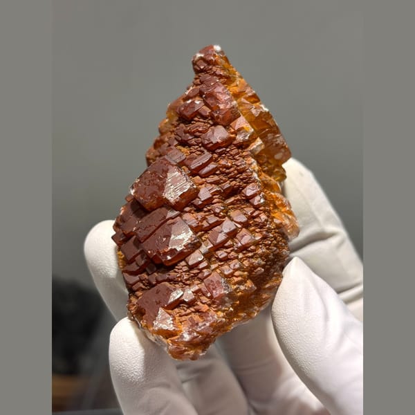 Glossy orange red calcite crystal cluster from Hubei — alternate view
