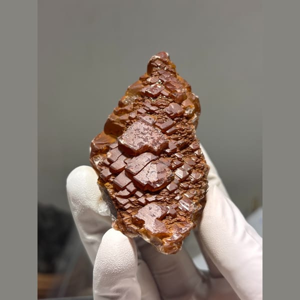 Glossy orange red calcite crystal cluster from Hubei — alternate view