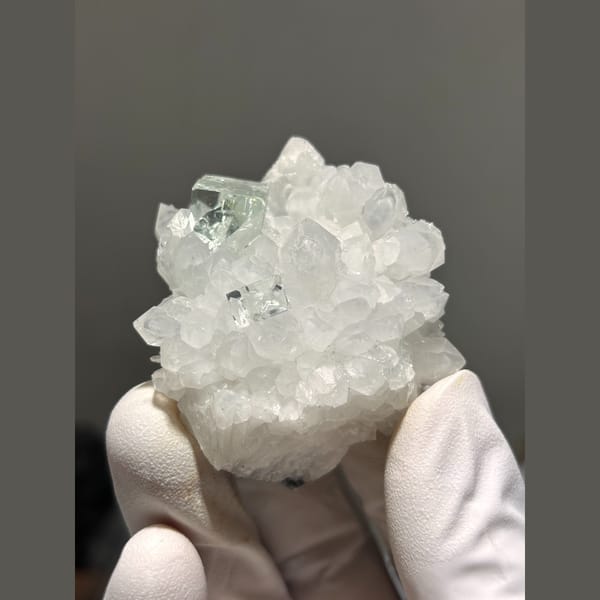 Pale green fluorite on frosty white quartz from Zhejiang — detail view