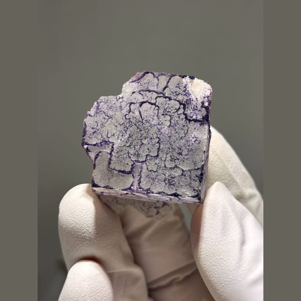 White fluorite with purple maze edging from Guizhou — detail view