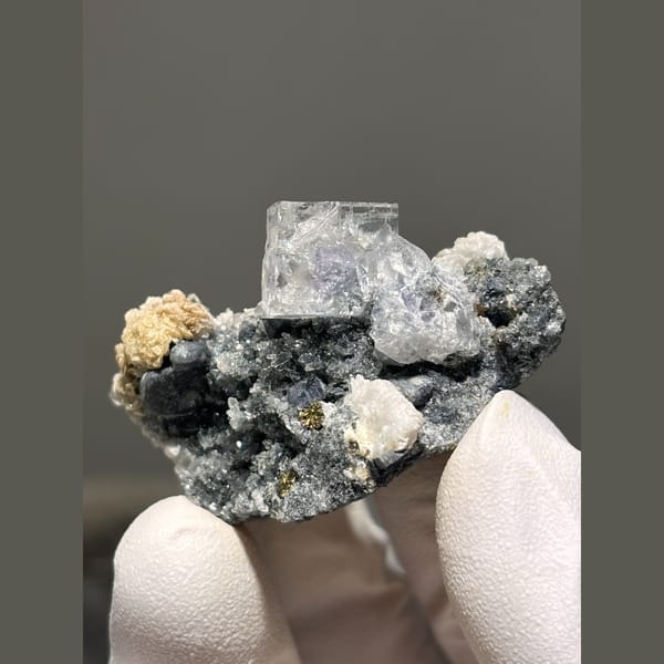 Pale blue fluorite with calcite and galena — complete view
