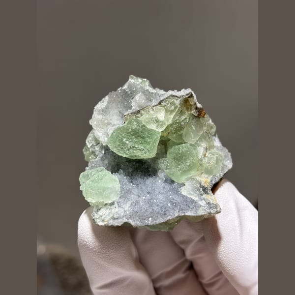 Rounded green fluorite cluster with quartz from Fujian — detail view