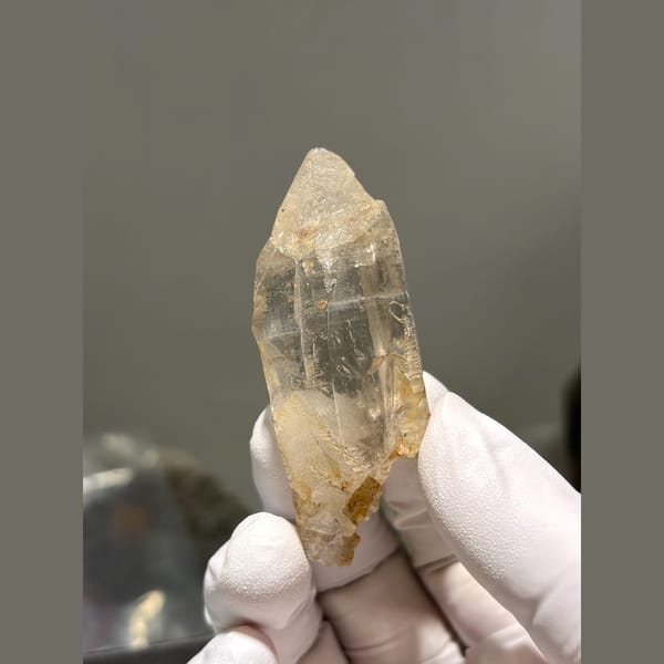 Golden iron stained quartz point from Pakistan — complete view