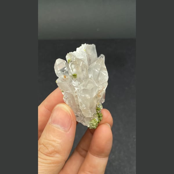 Clear quartz crystal fan with green epidote from Meigu — alternate view