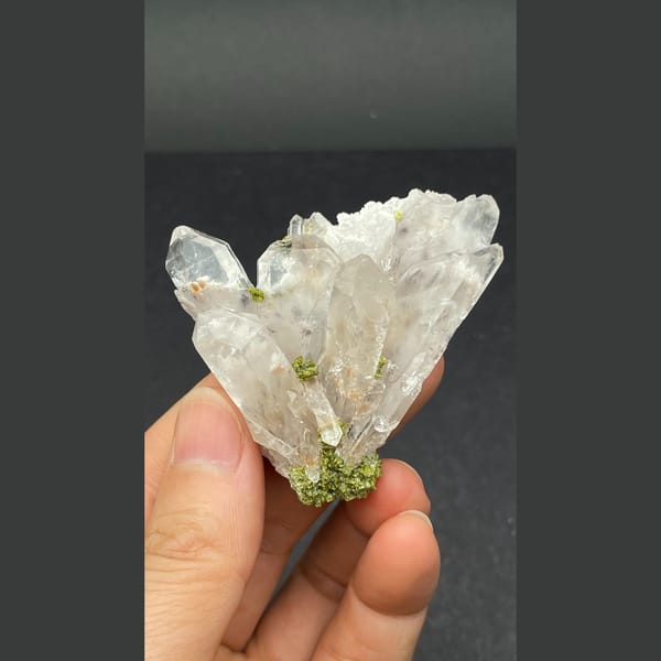 Clear quartz crystal fan with green epidote from Meigu — alternate view
