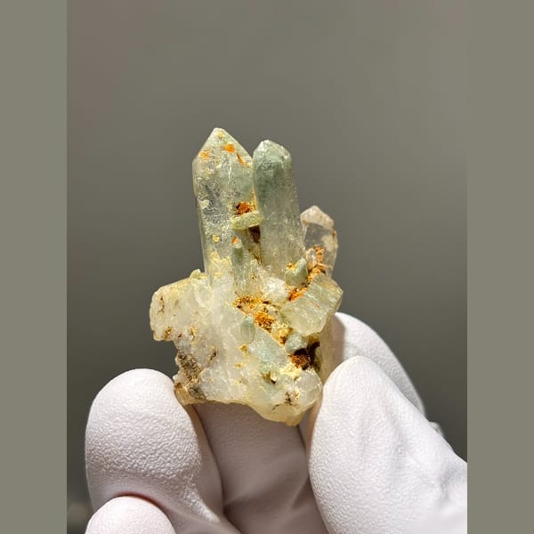 Small pale quartz cluster with rusty spots from Tibet — complete view