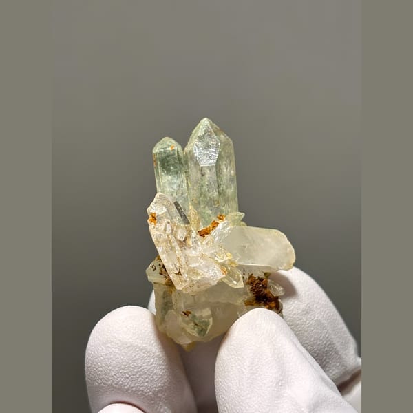 Small pale quartz cluster with rusty spots from Tibet — detail view