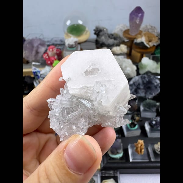 Hexagonal white biscuit calcite on clear quartz — complete view