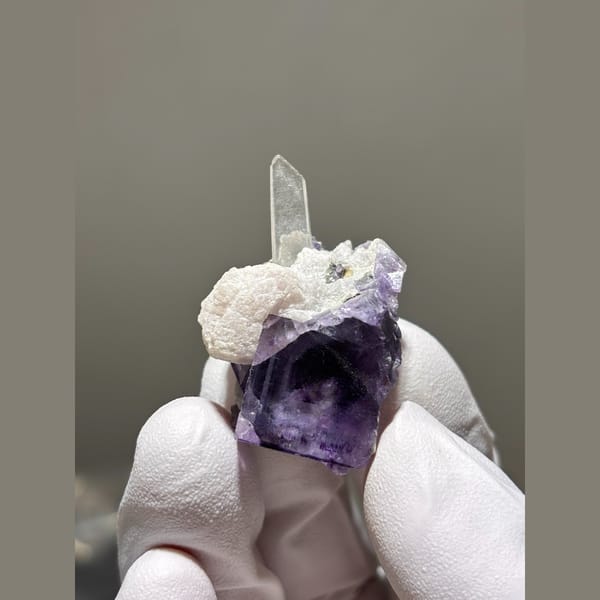 Purple fluorite cube with quartz and calcite from Yaogangxian — alternate view