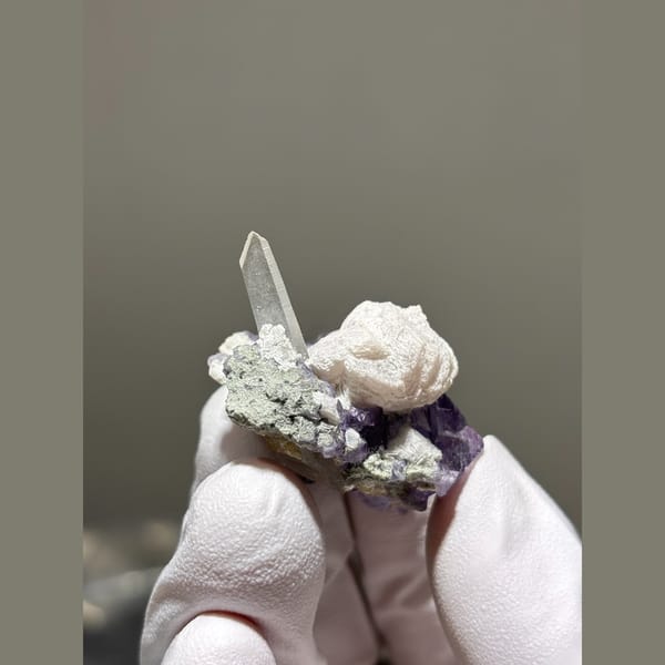 Purple fluorite cube with quartz and calcite from Yaogangxian — alternate view