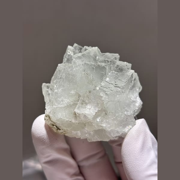 Frosted stepped clear fluorite from Xianghualing — complete view