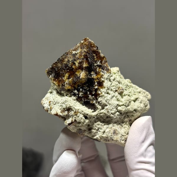 Dark lustrous vesuvianite crystal from Hebei — complete view