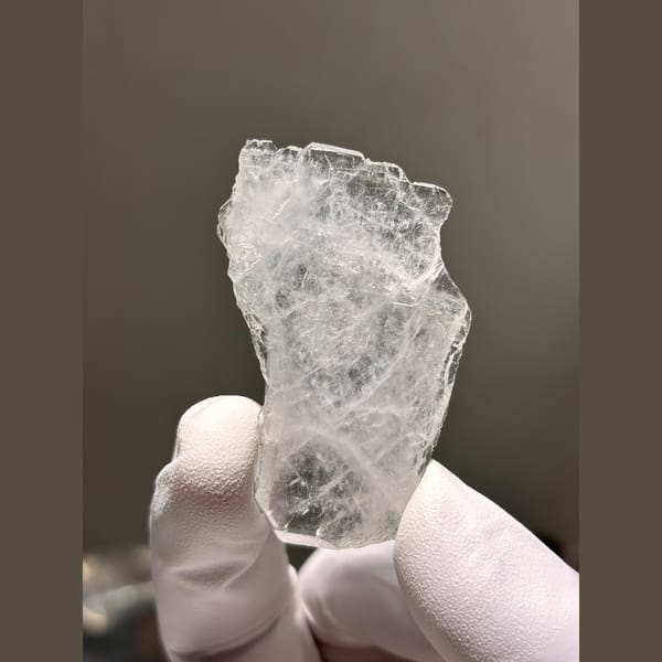 Thin flat clear quartz blade from Xuebaoding — complete view