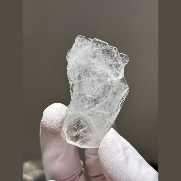 Thin flat clear quartz blade from Xuebaoding — alternate view