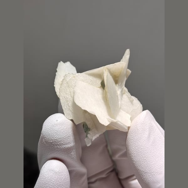 Intersecting white bladed calcite from Hunan — detail view