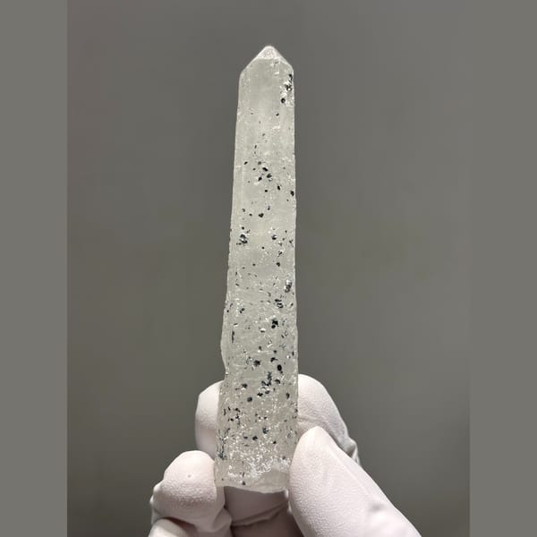 Long slender quartz with dark speck inclusions from Inner Mongolia — alternate view
