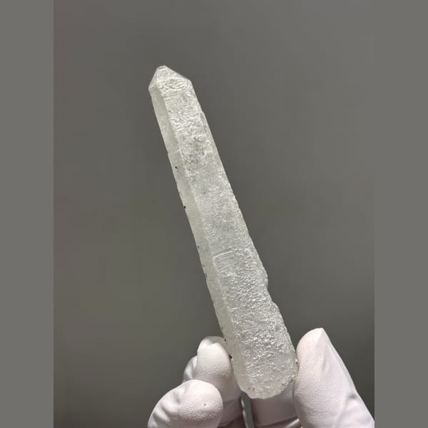 Long slender quartz with dark speck inclusions from Inner Mongolia — alternate view