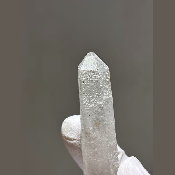 Long slender quartz with dark speck inclusions from Inner Mongolia — detail view