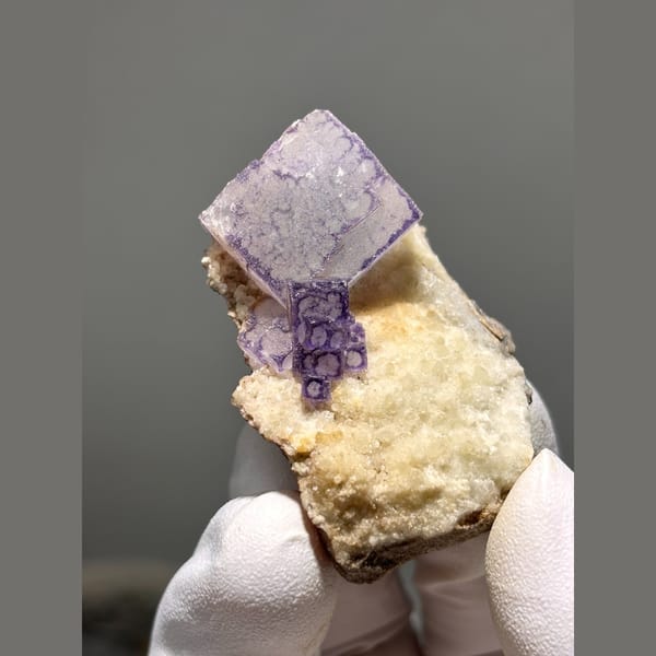 Clear fluorite cube with purple edges from Guizhou — complete view
