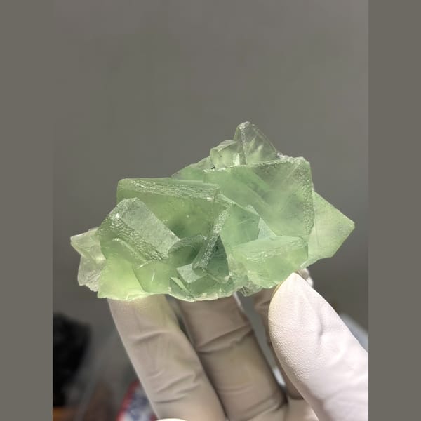 Translucent pale green fluorite cluster from Fujian — complete view